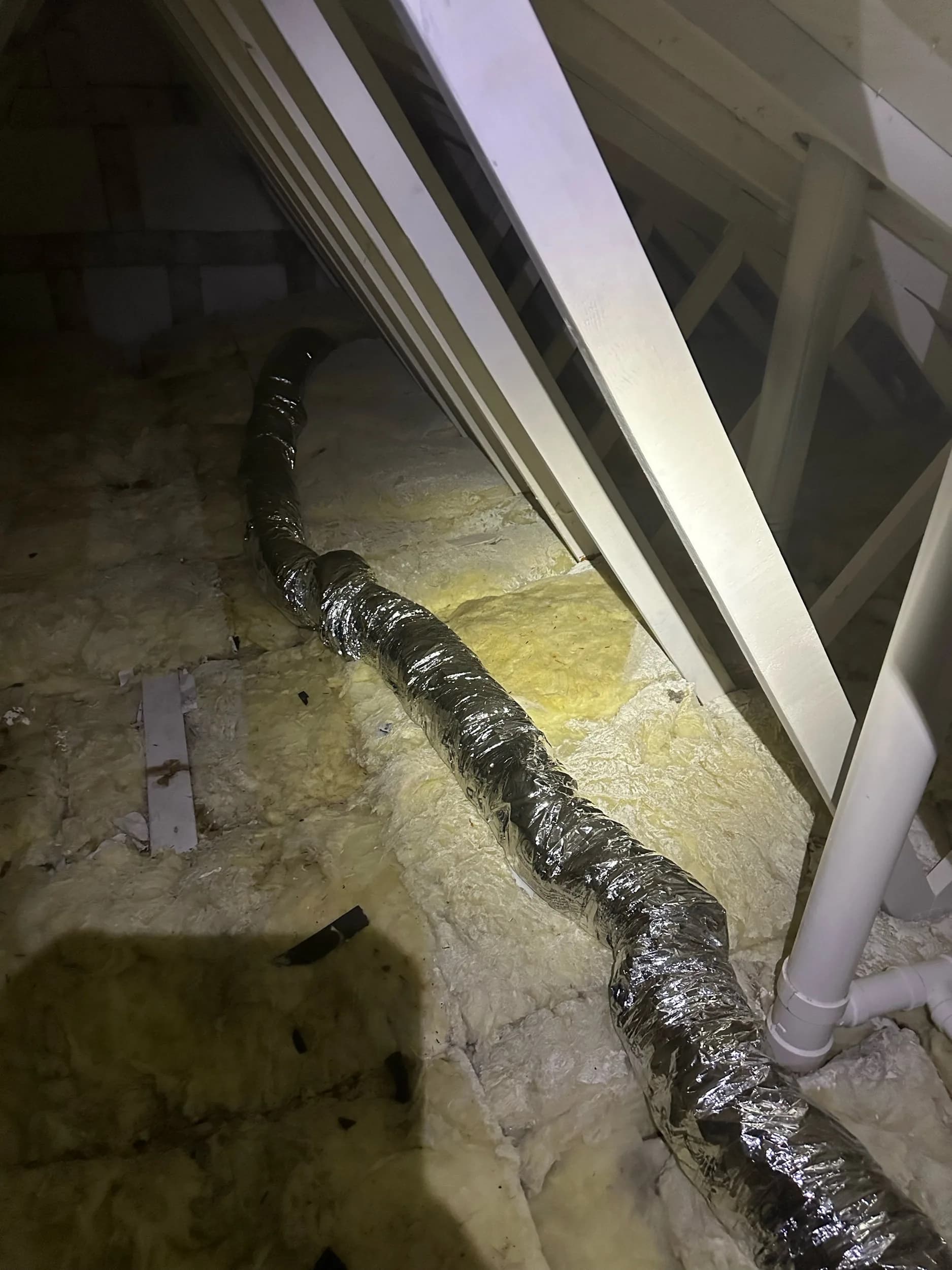 Attic Flex Duct Running Across Insulation