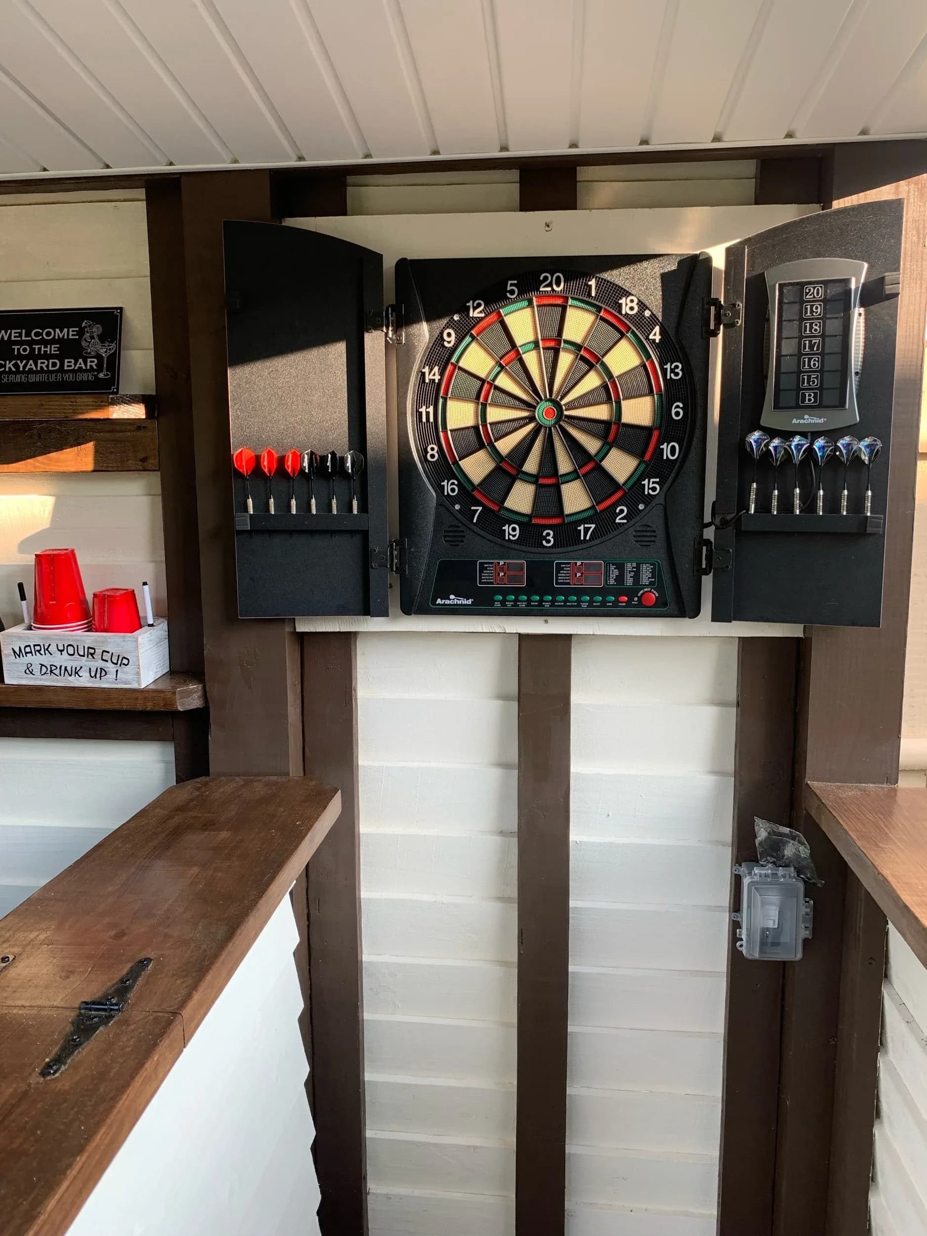 Backyard Bar Pergola With TV And Dartboard Setup