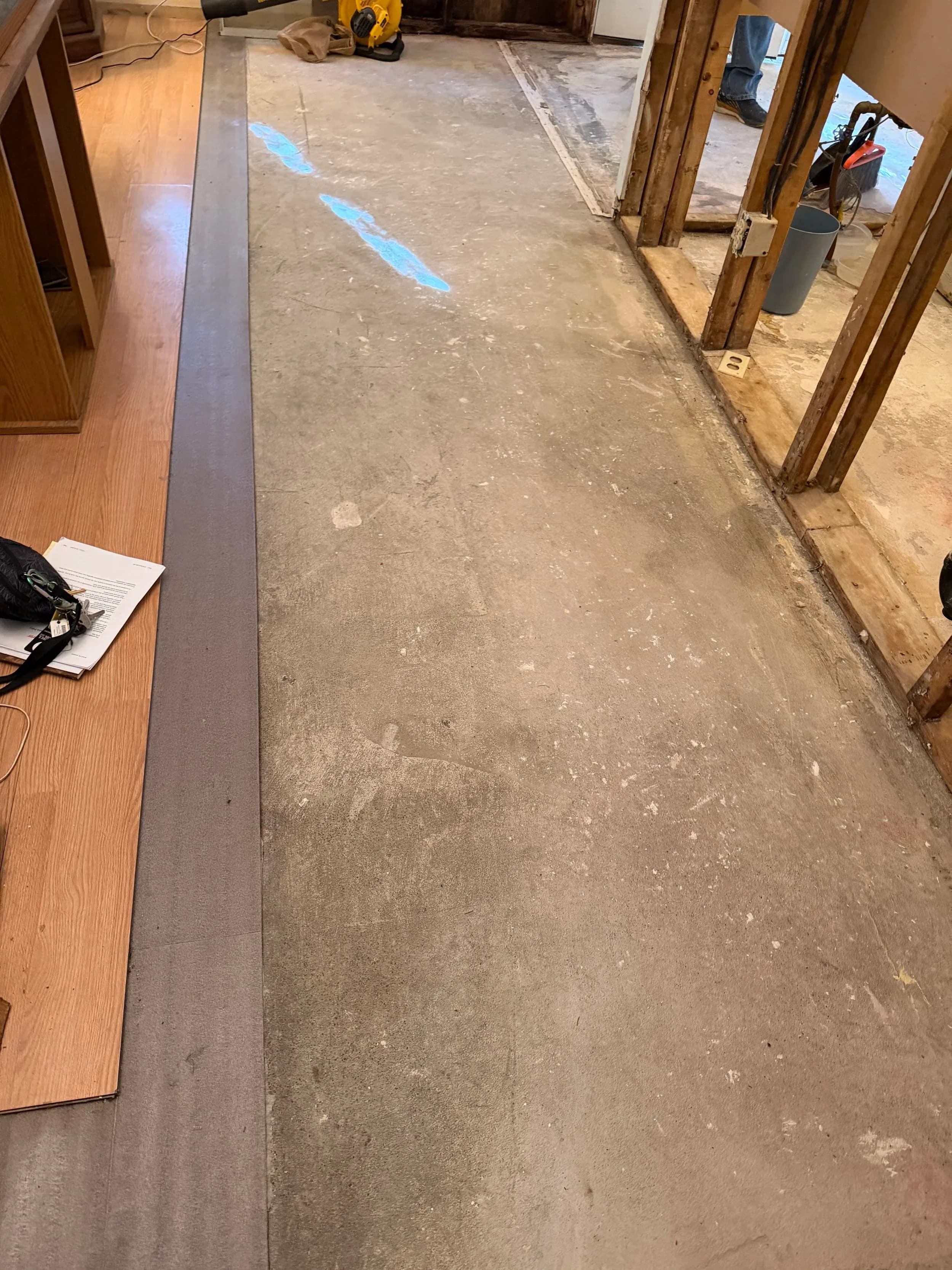 Bare Concrete Subfloor Hallway Exposed Framing Renovation