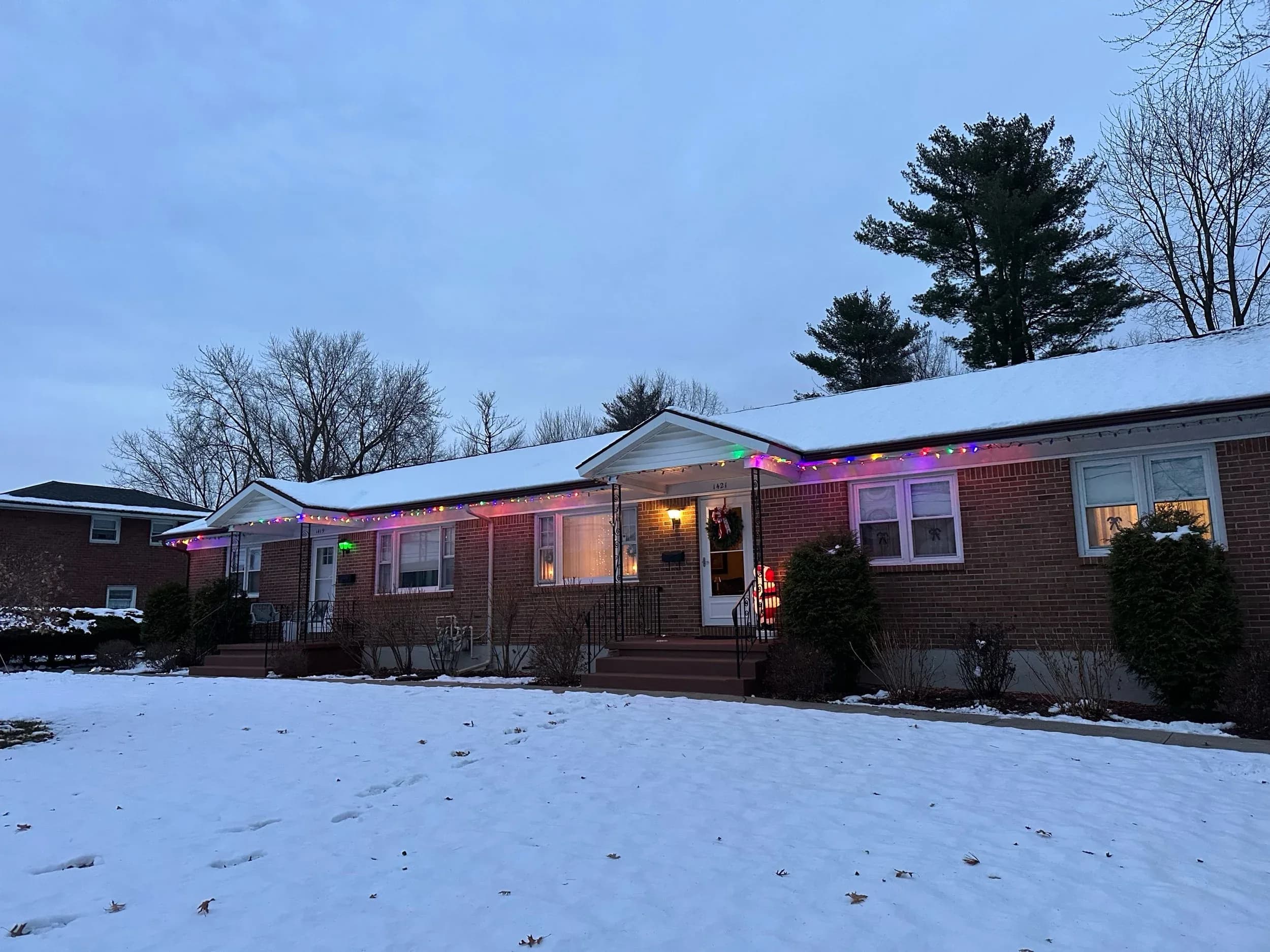 Brick Ranch Home Holiday String Lights Winter Dusk