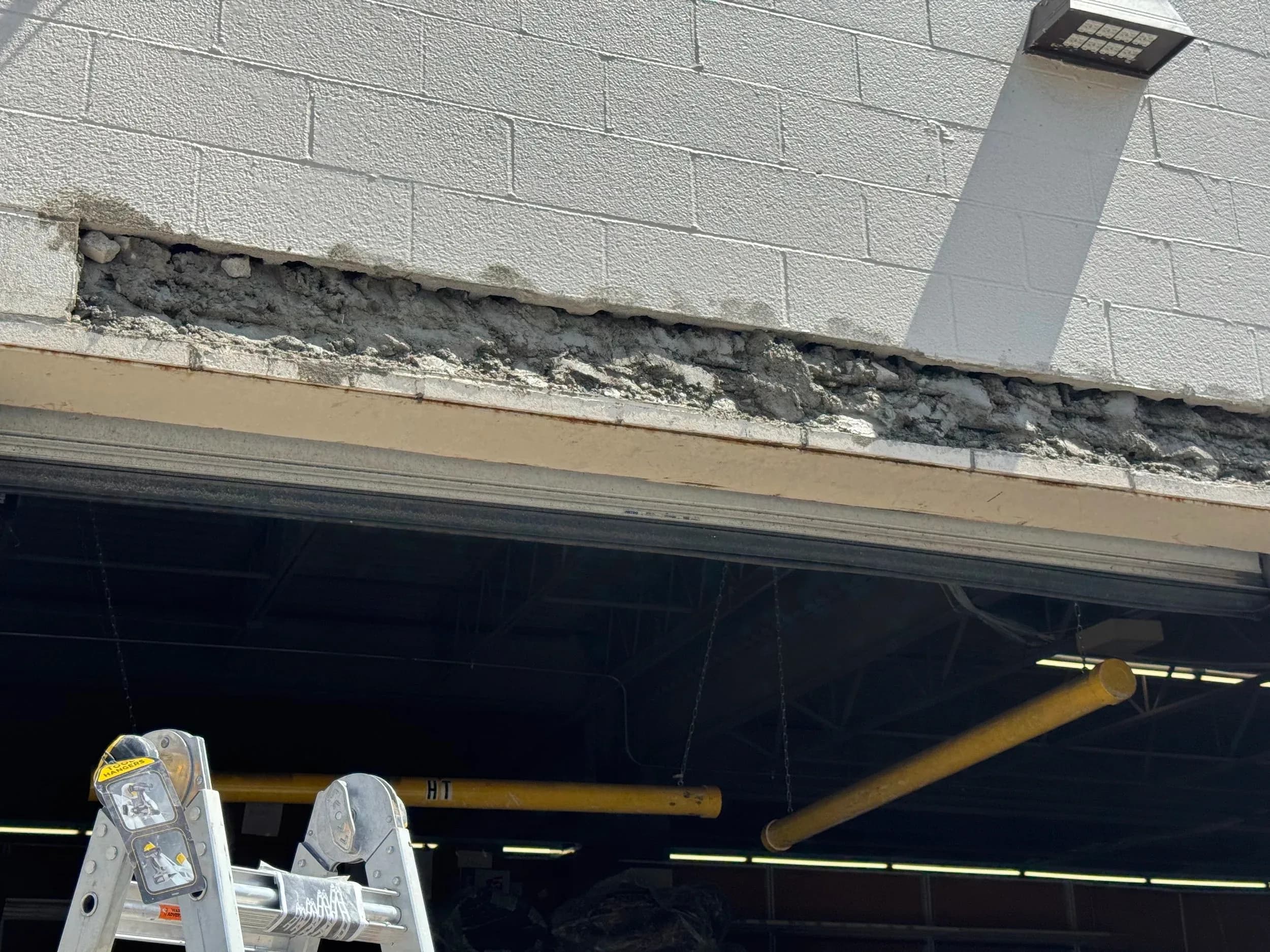 Commercial Loading Dock Door Deteriorated Concrete Lintel Wide
