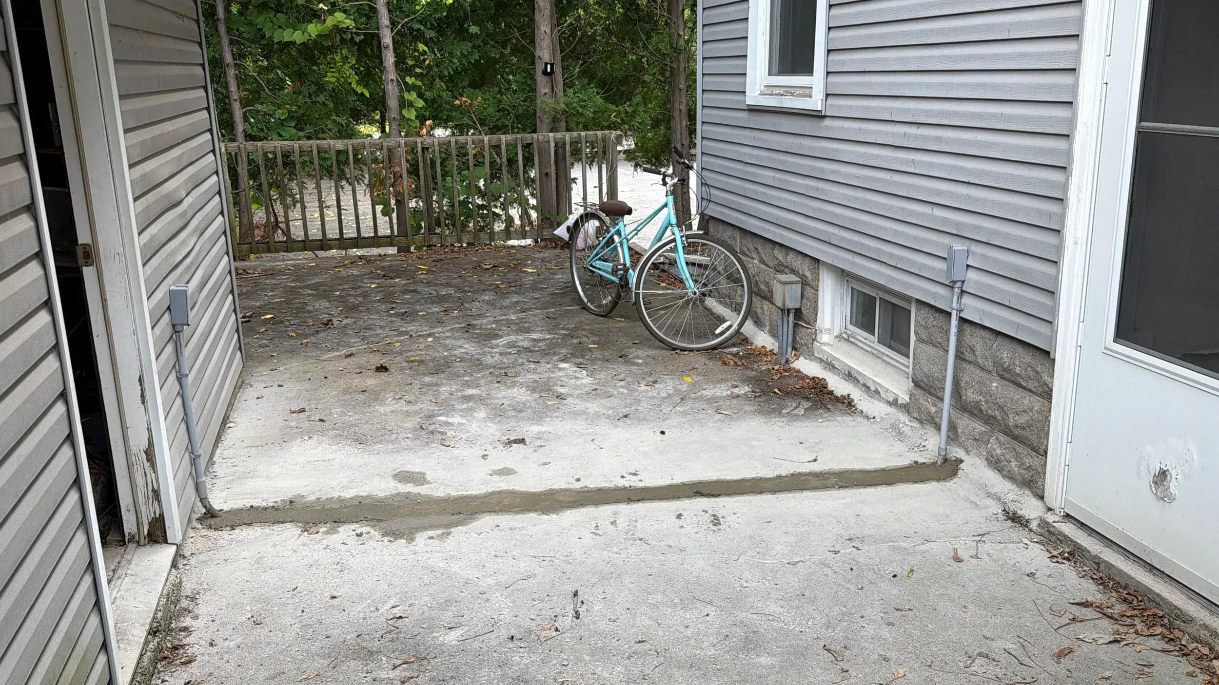 Concrete Patio Slab Pour Foundation Edge Teal Bicycle Angle 2