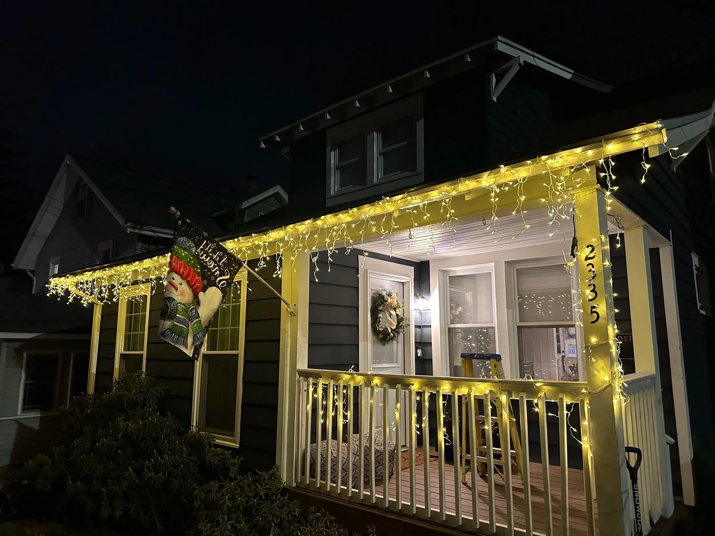 Craftsman Porch Icicle Lights Installation Night Tilted Angle