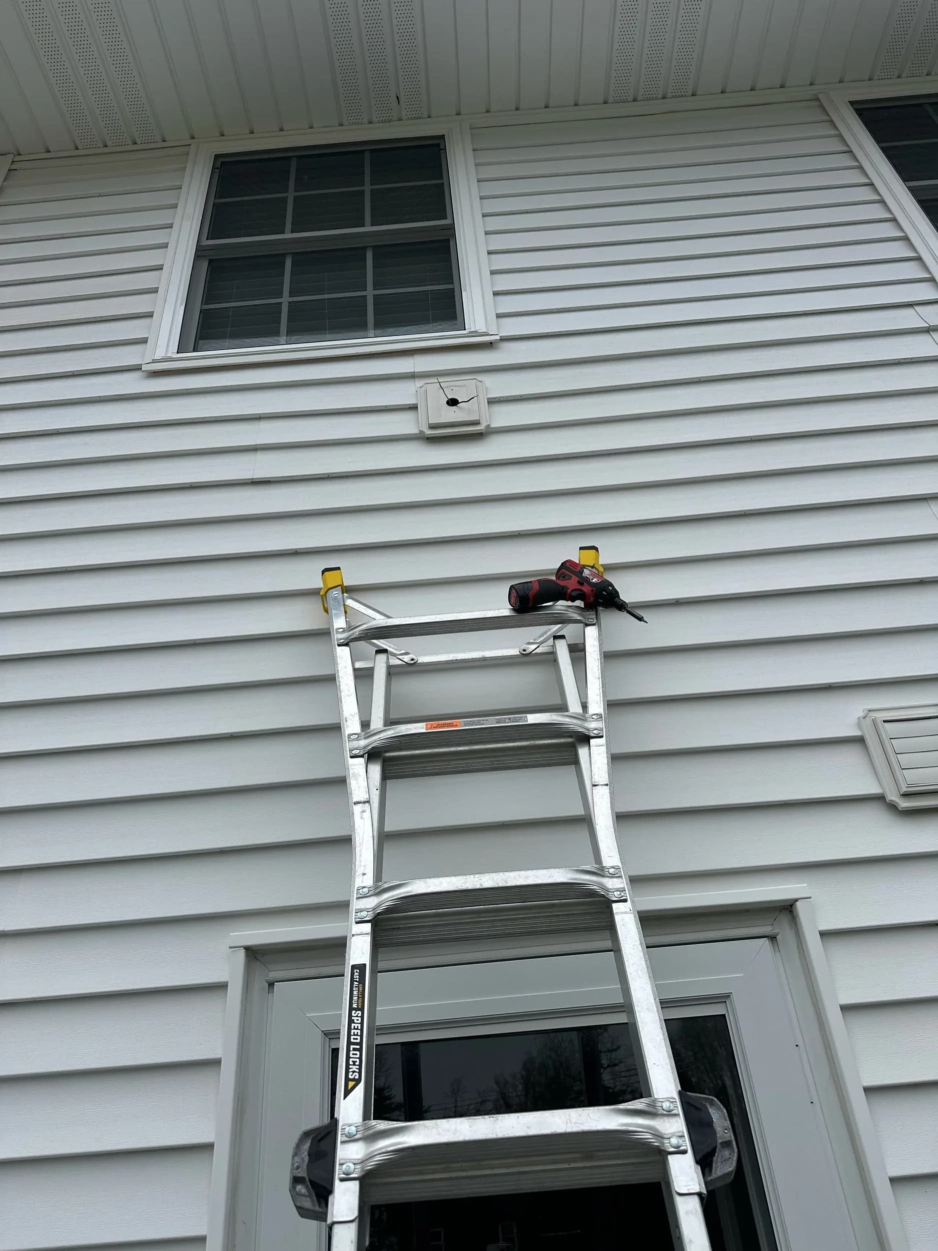 Extension Ladder Exterior Siding Dryer Vent Repair
