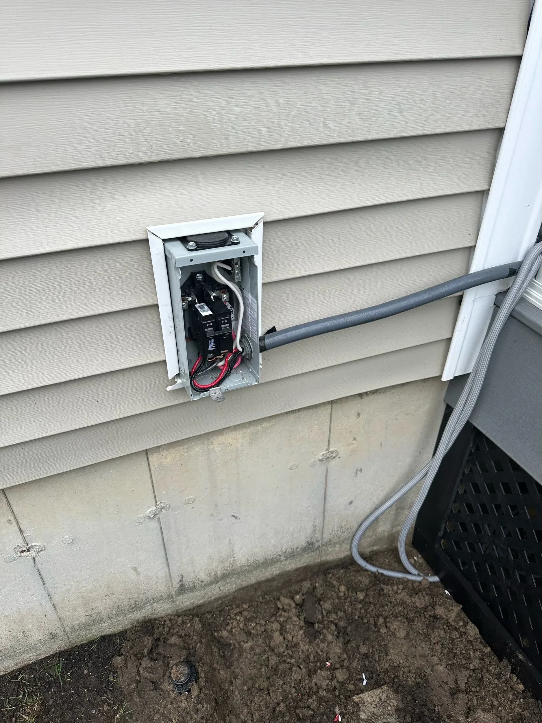 Exterior Electrical Subpanel Breakers Installed Siding