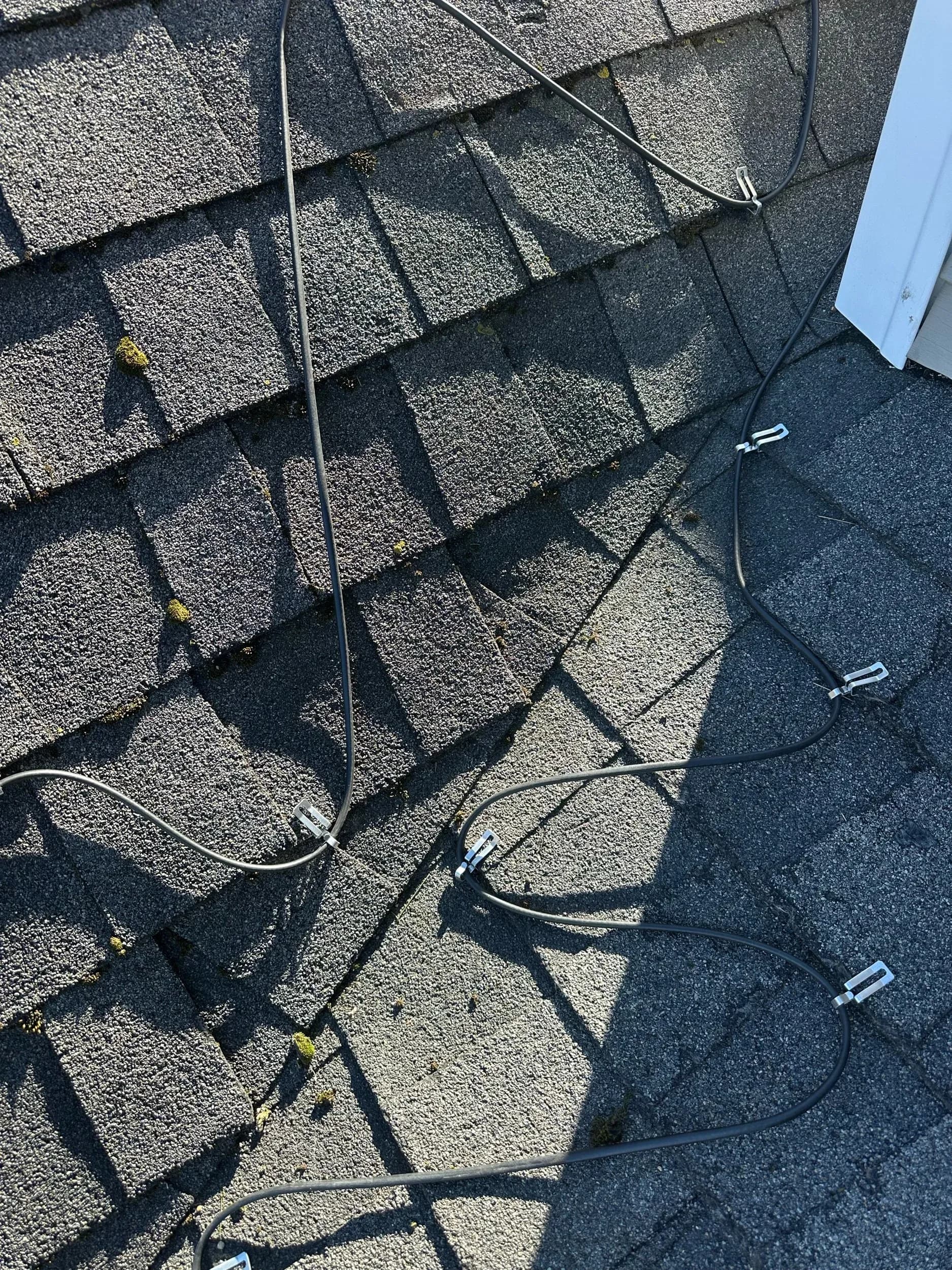 Holiday Light Clip Zigzag Pattern Shingle Roof Closeup