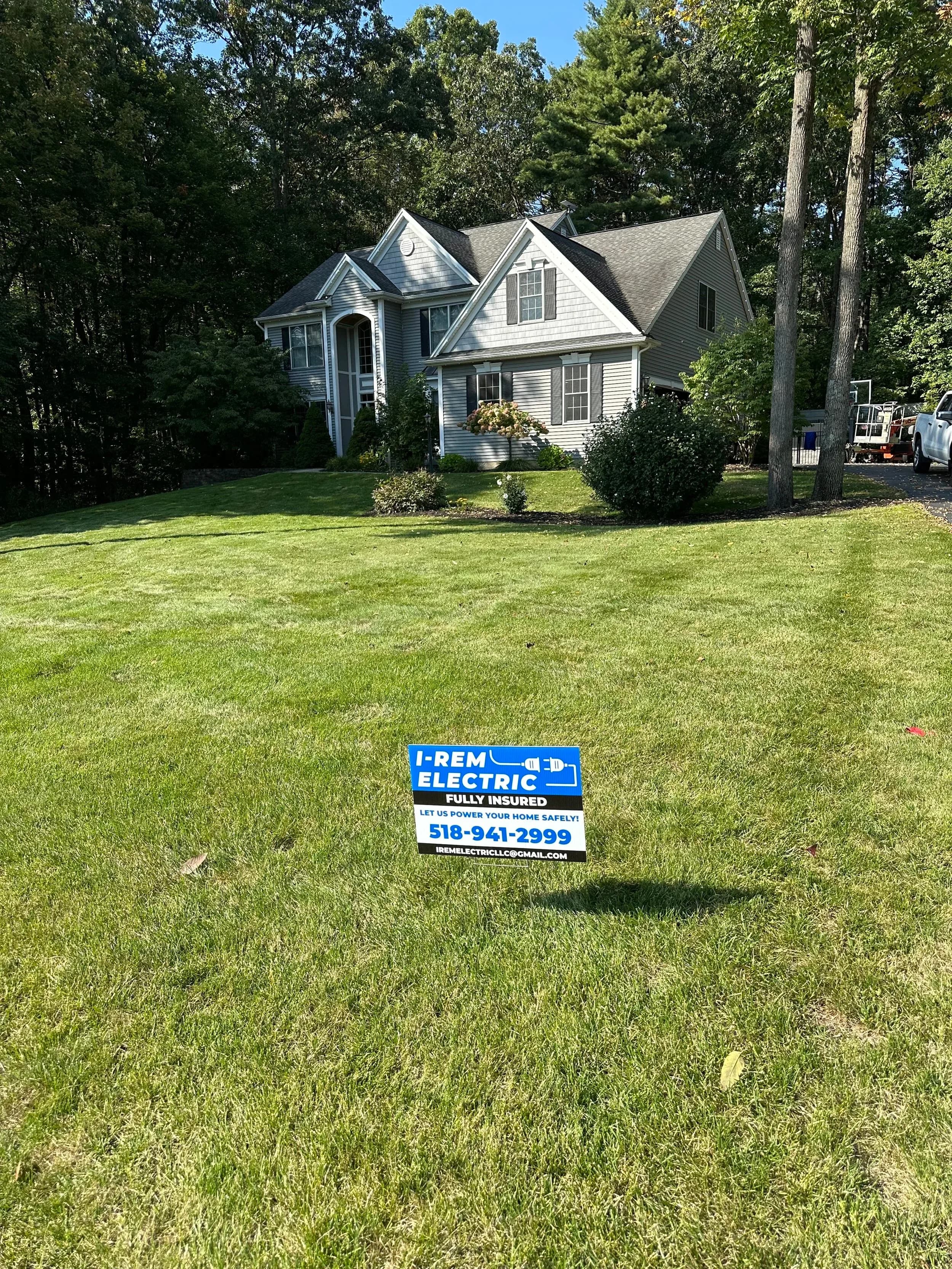 I Rem Electric Yard Sign Front Lawn Closeup