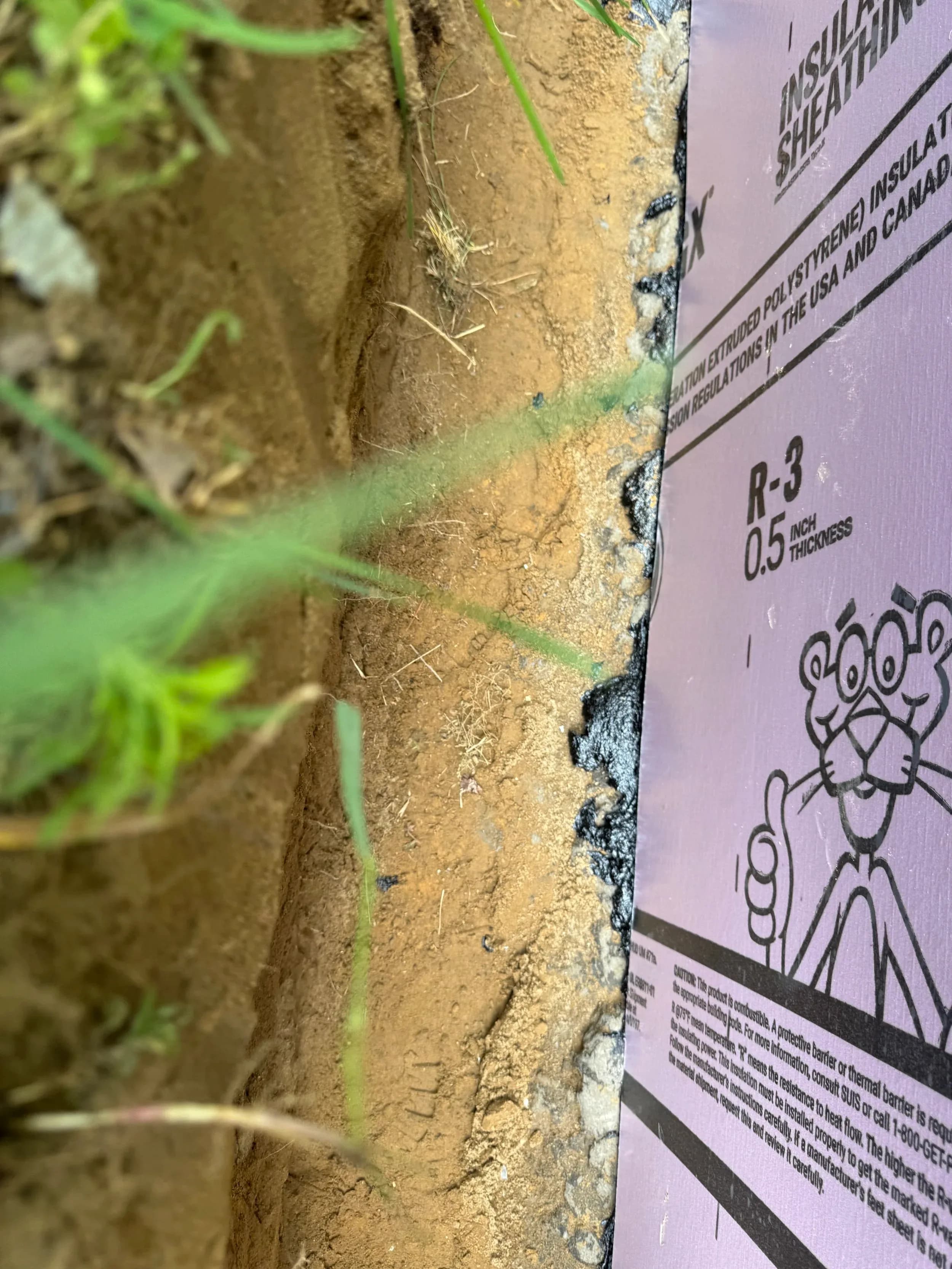 Insulating Sheathing Board Closeup R3 Label Foundation Trench