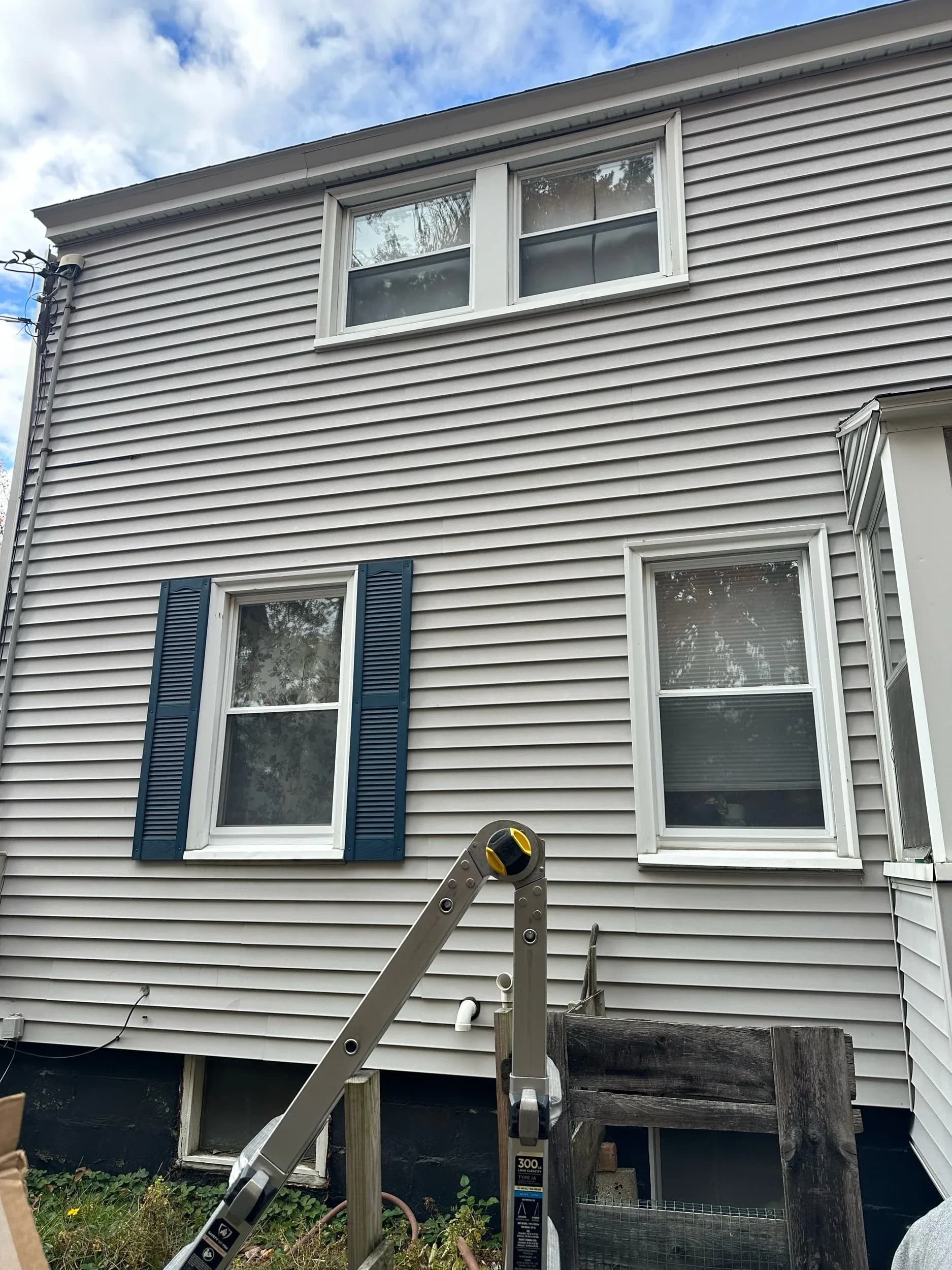Navy Blue Window Shutters Closeup Siding