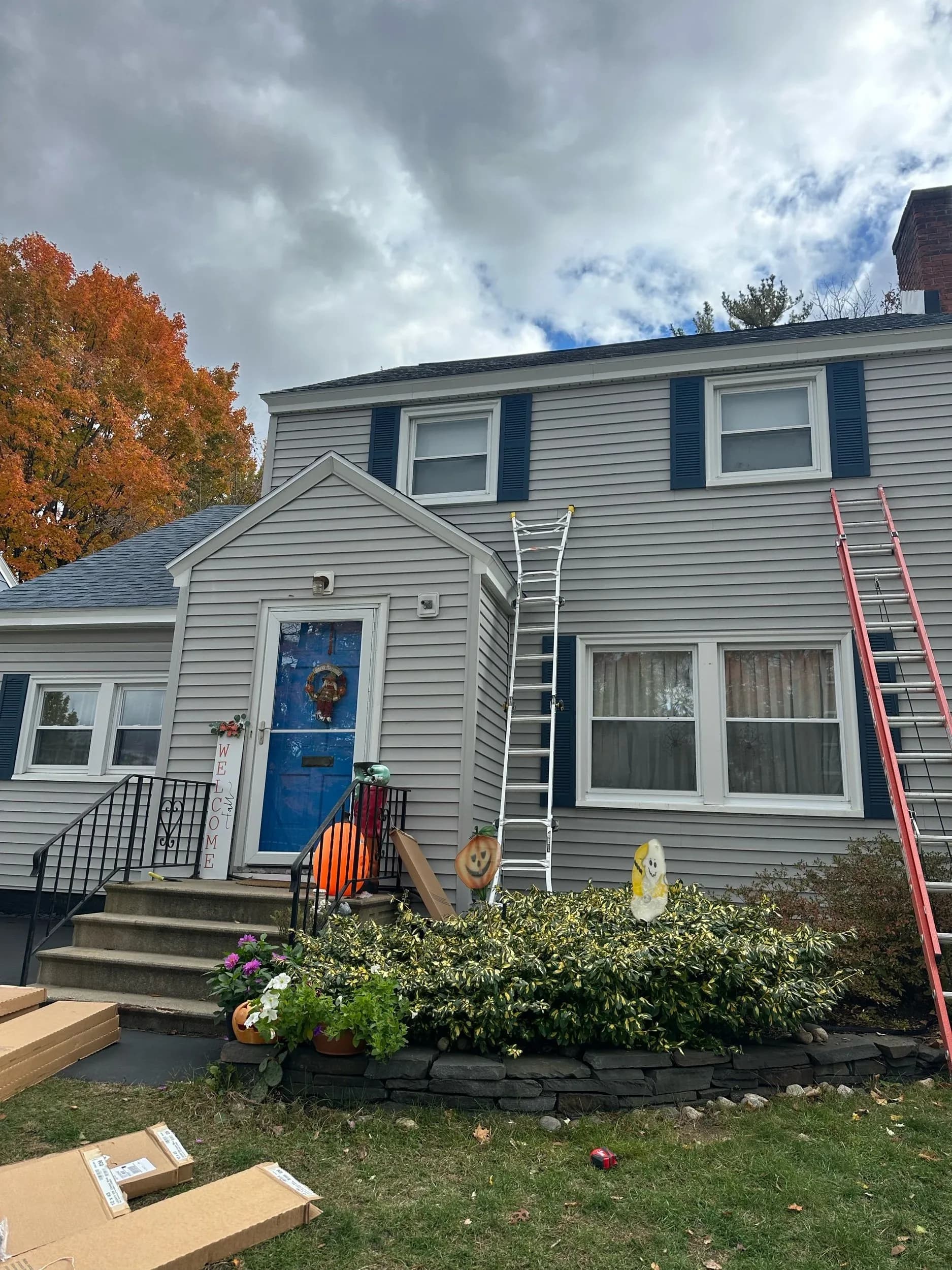 Navy Shutters Installed Two Story Home Ladders