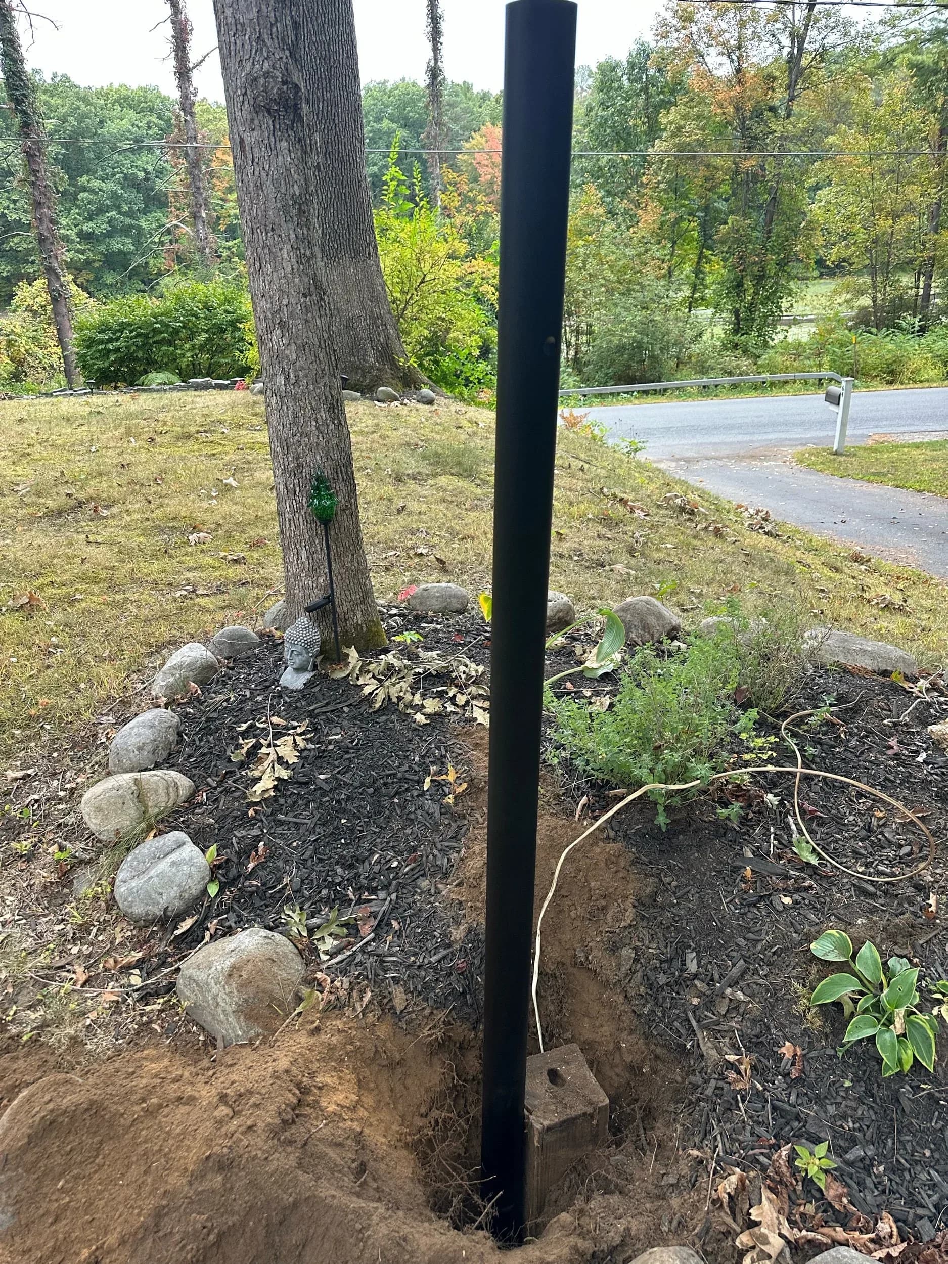 Outdoor Post Light Conduit Riser In Garden Bed