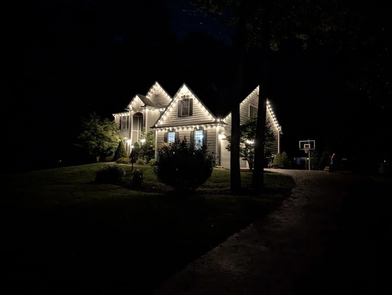 Permanent Outdoor LED Roofline Lighting White House Driveway Dusk View