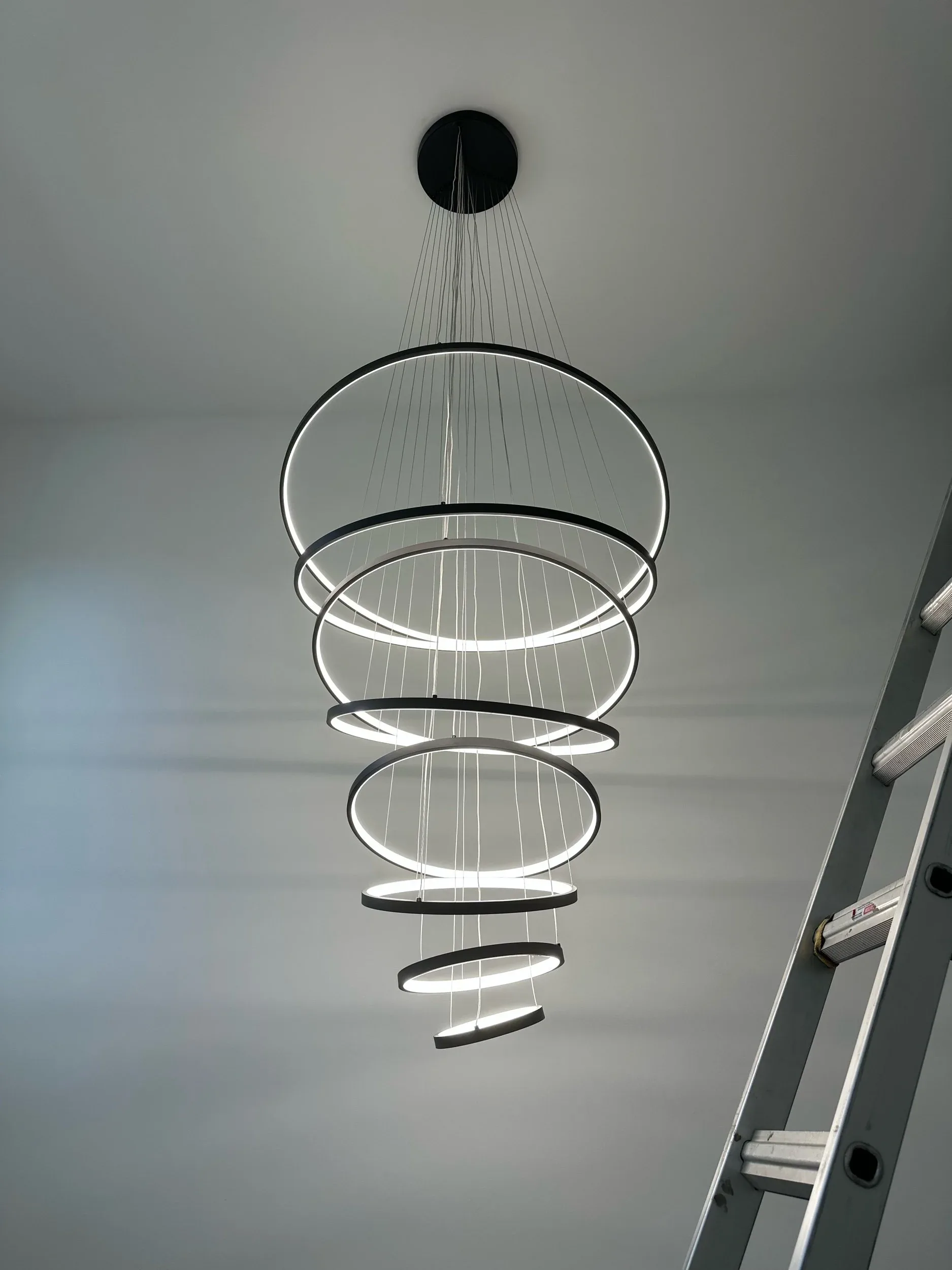 Spiral Chandelier Lit Foyer Entryway Rug View