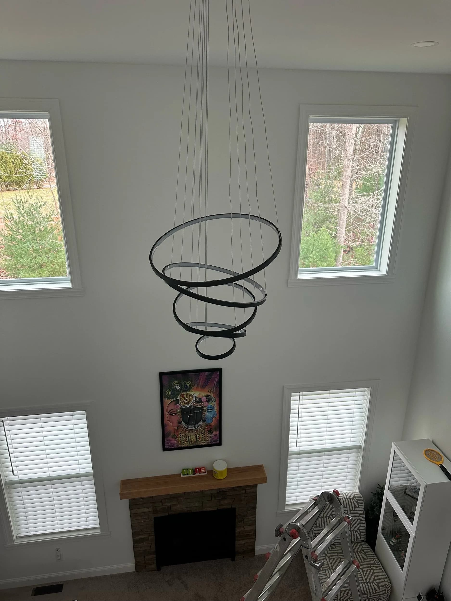 Spiral Chandelier Unlit Fireplace Room Alternate Angle