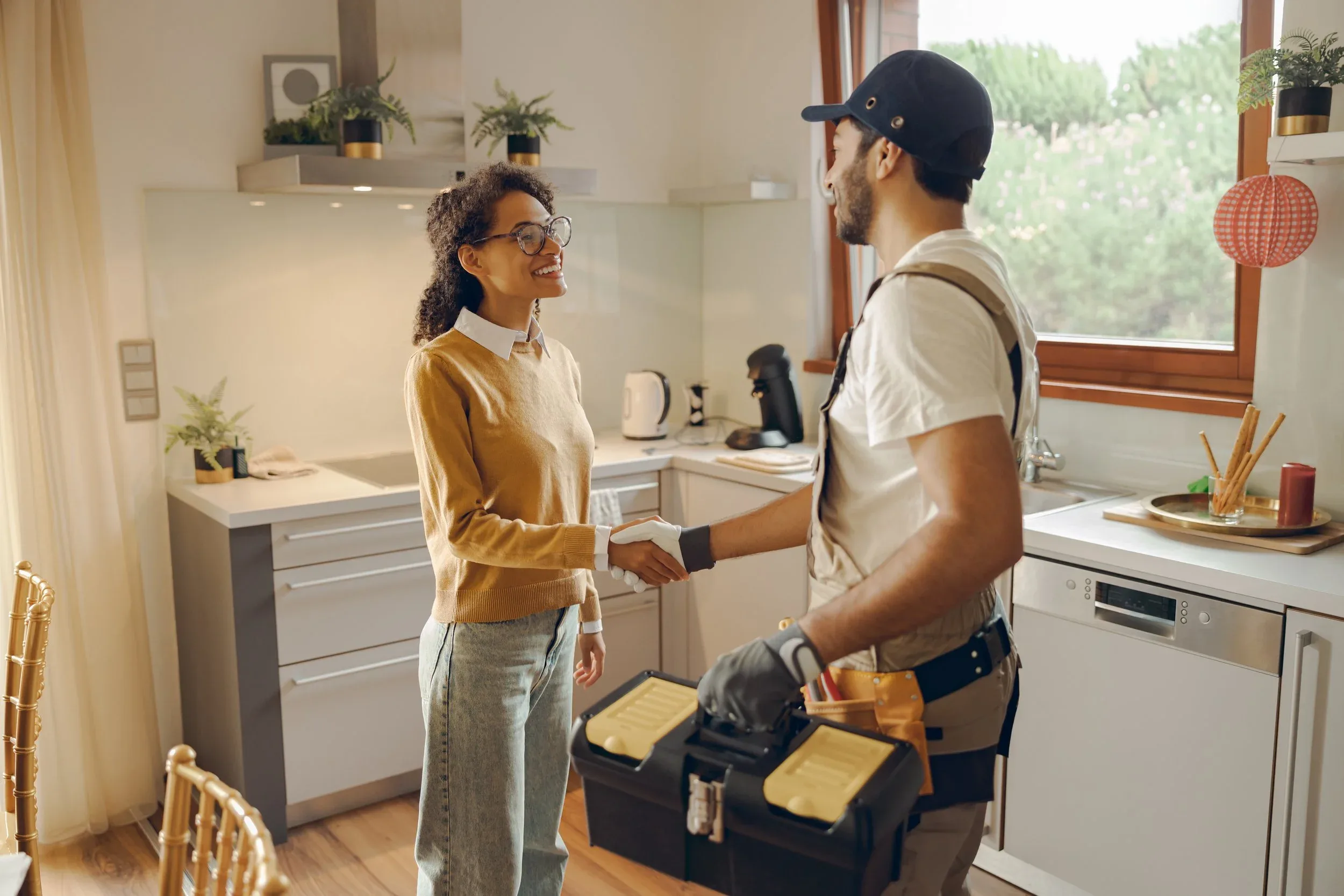 Stock Photo Electrician Handshake Homeowner Kitchen Toolbox
