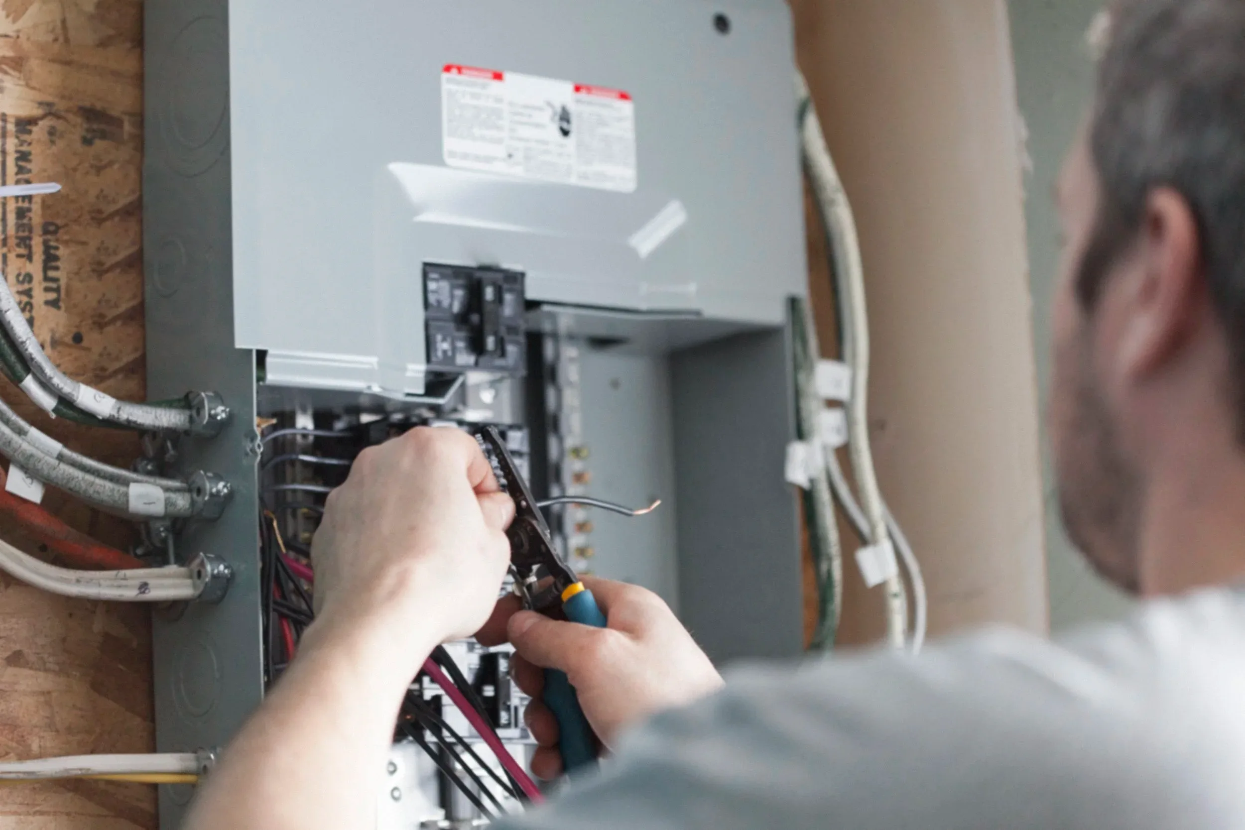 Stock Photo Electrician Wiring Breaker Panel Closeup Hands