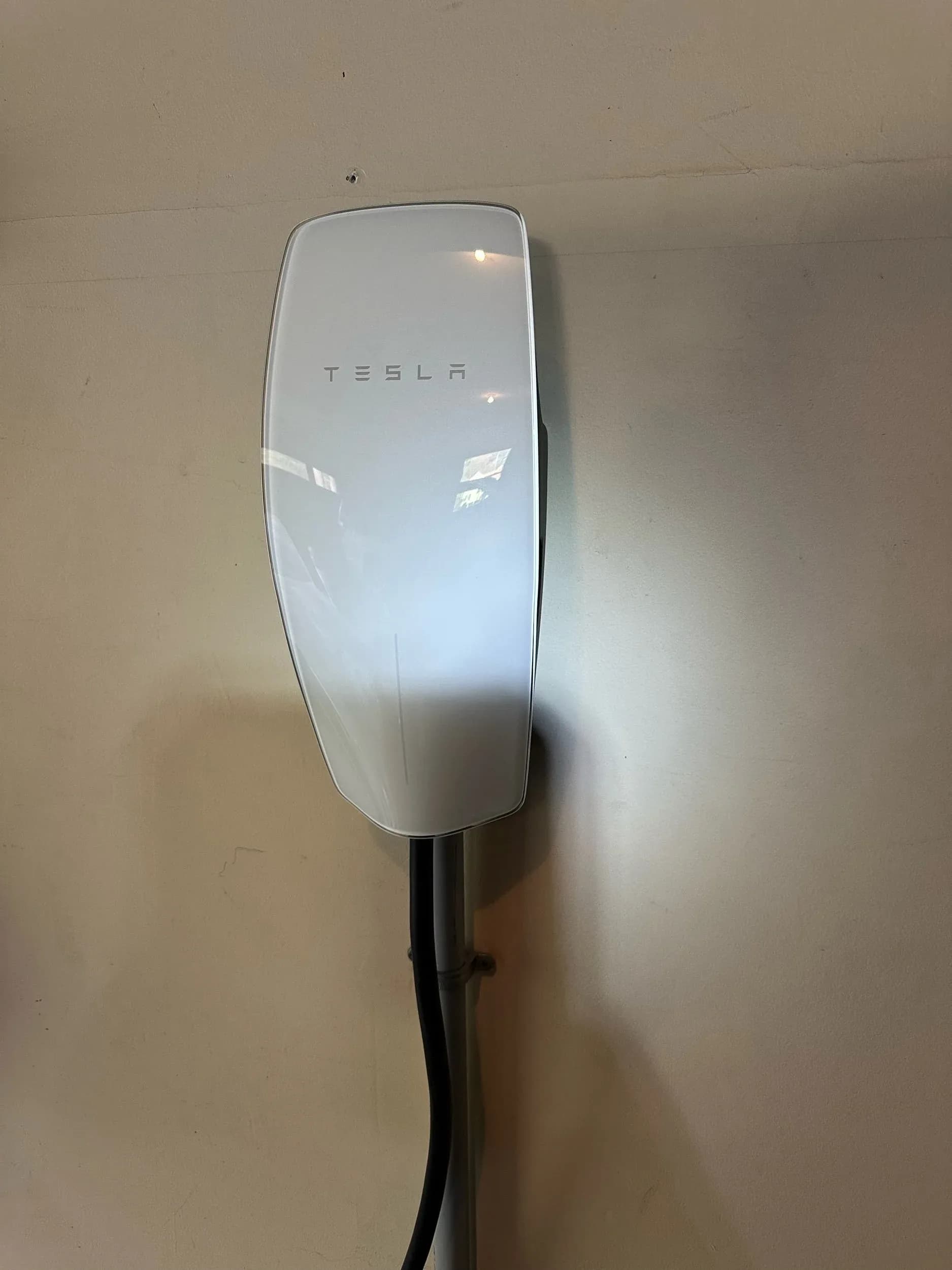 Tesla Wall Connector EV Charger Closeup Mounted Wall