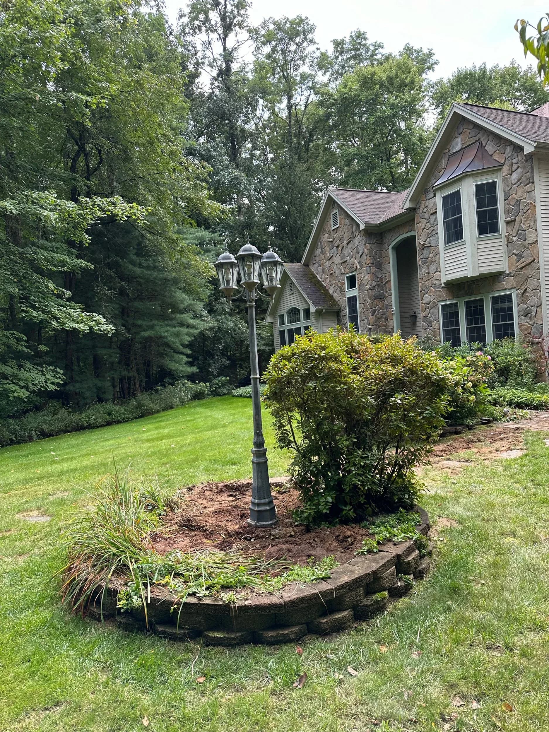 Three Head Lamp Post Installation Landscape Bed