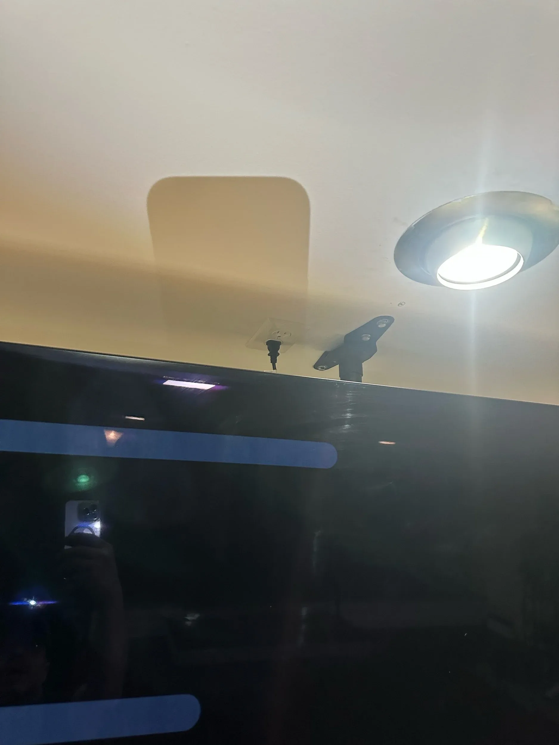 TV Mount Outlet And Bracket Behind Screen Closeup