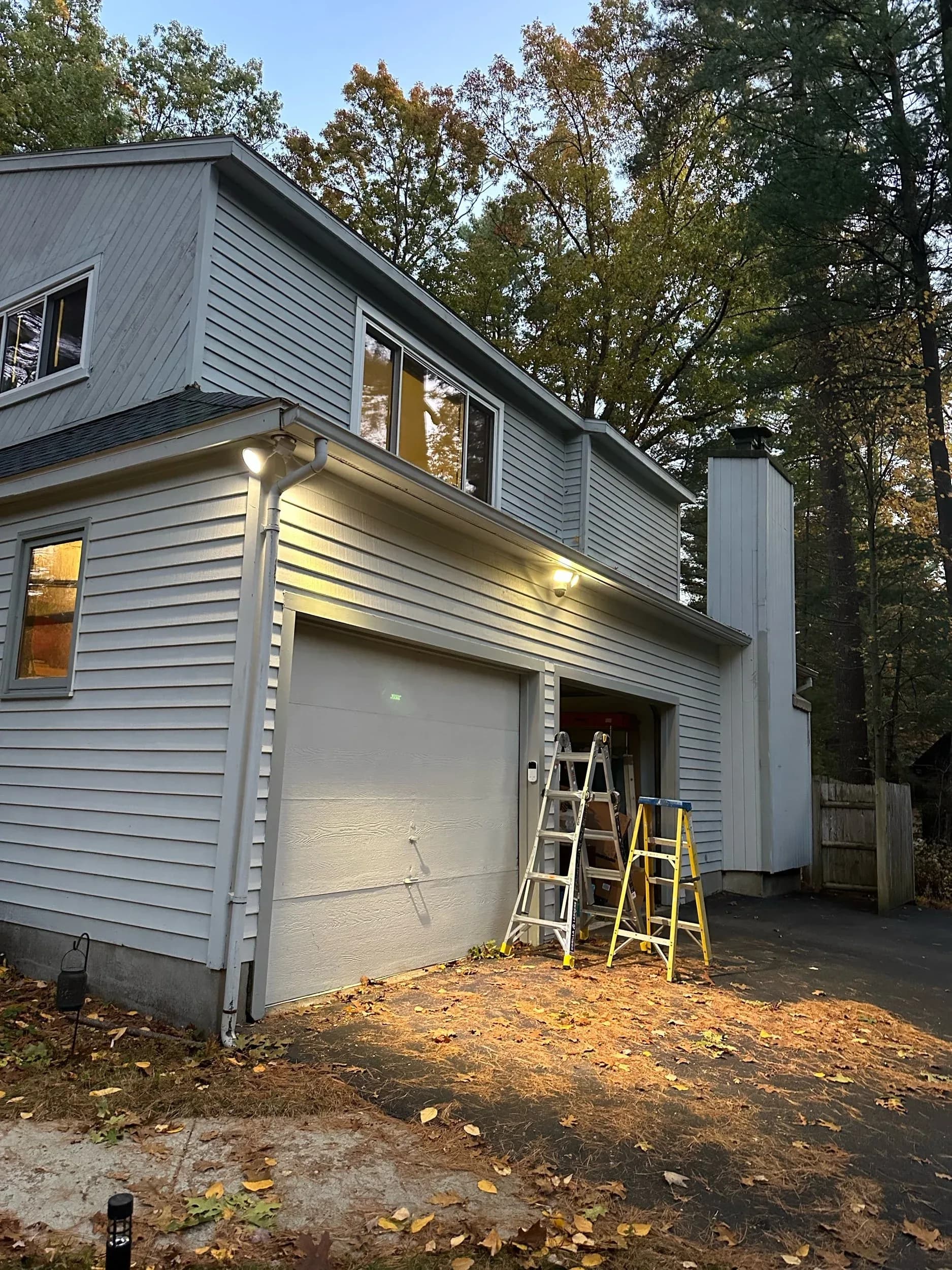 Two Story Garage Floodlight Ladders Dusk Jobsite