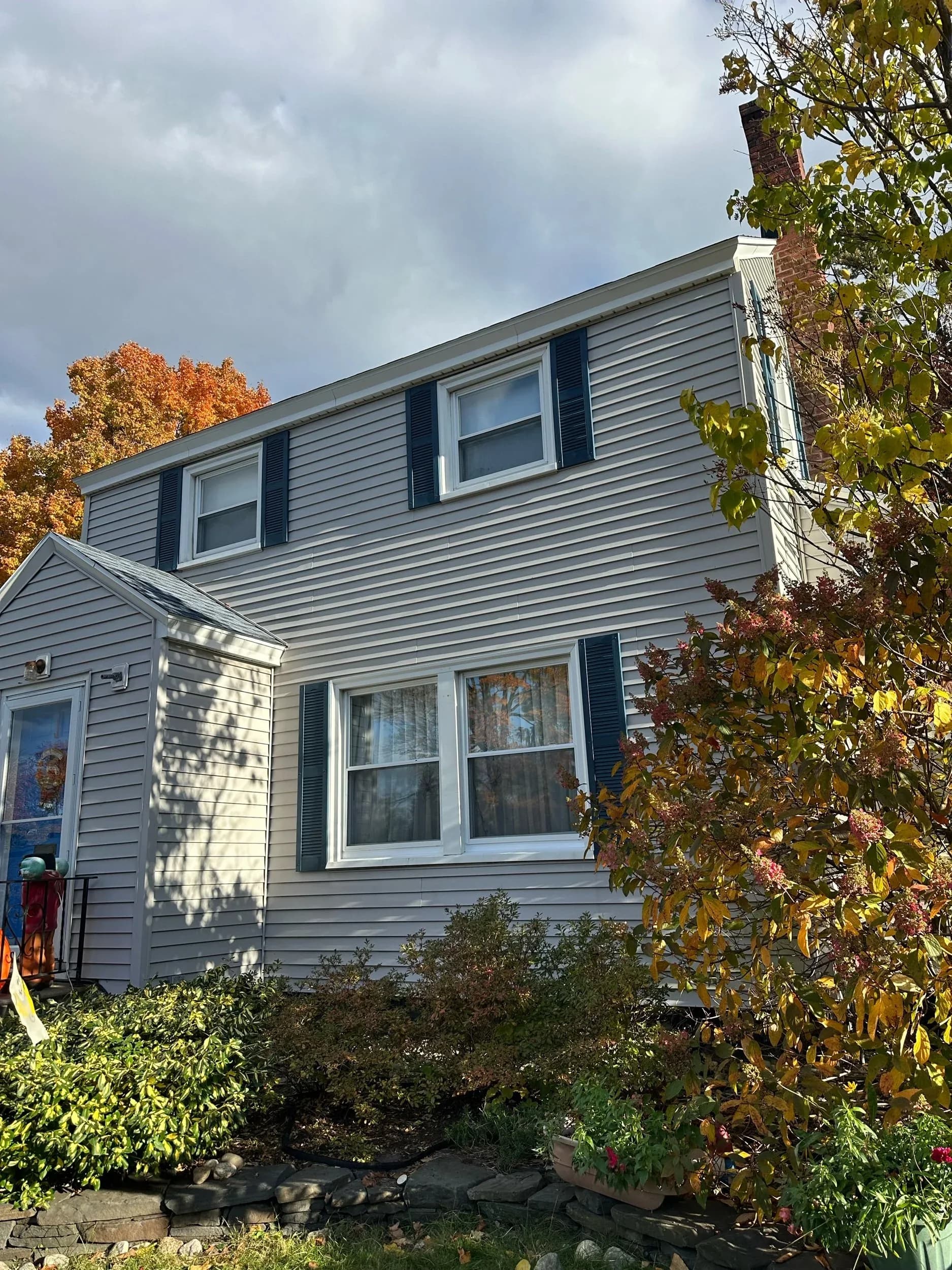 Two Story Home Navy Shutters Multiple Windows Fall