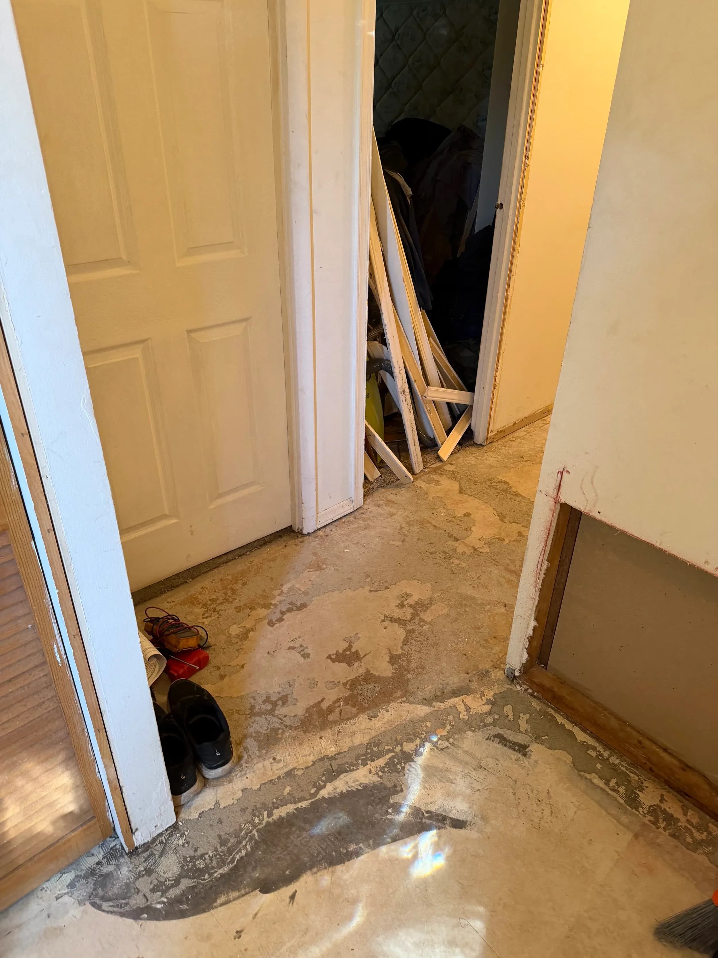 Water Damaged Hallway Closet Flooring Removed Debris
